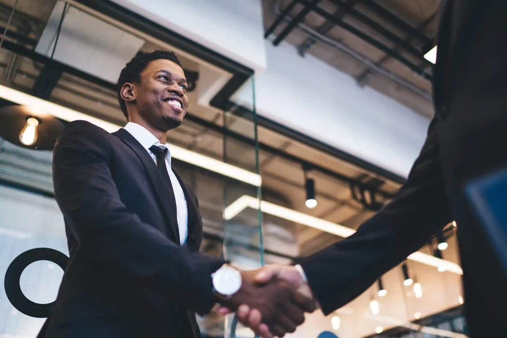 African American man smiling and shaking hands